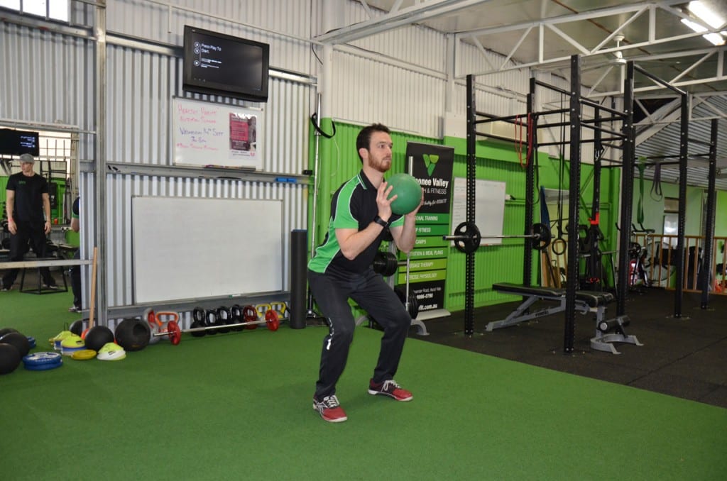 Medicine Ball Pass with a Squat - Personal Trainers, Exercise Physiology  and Clinical Pilates in Melbourne, VIC